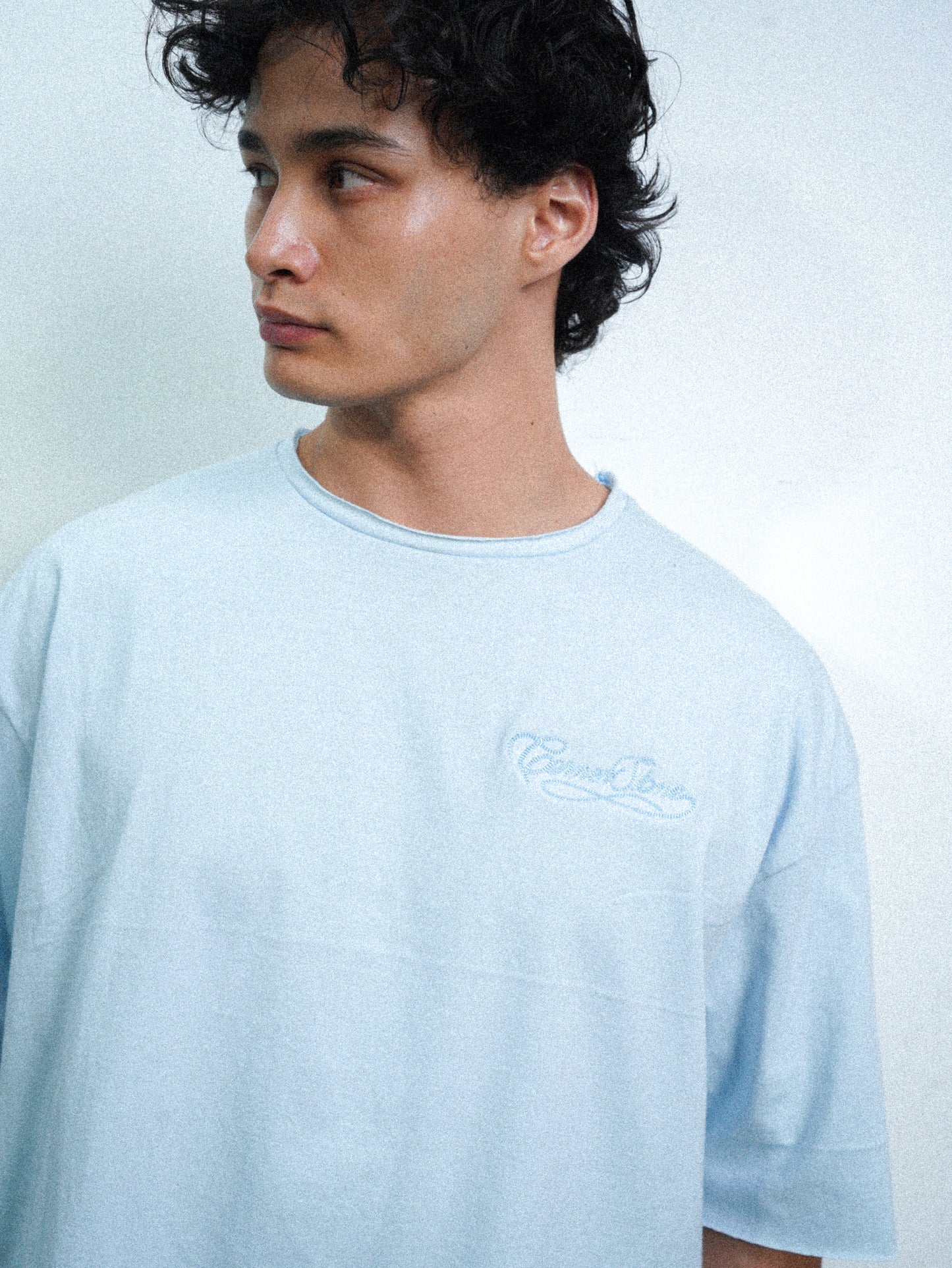 S/S26 DECONSTRUCTED EMBROIDERED RAW HEM TEE IN POWDER BLUE