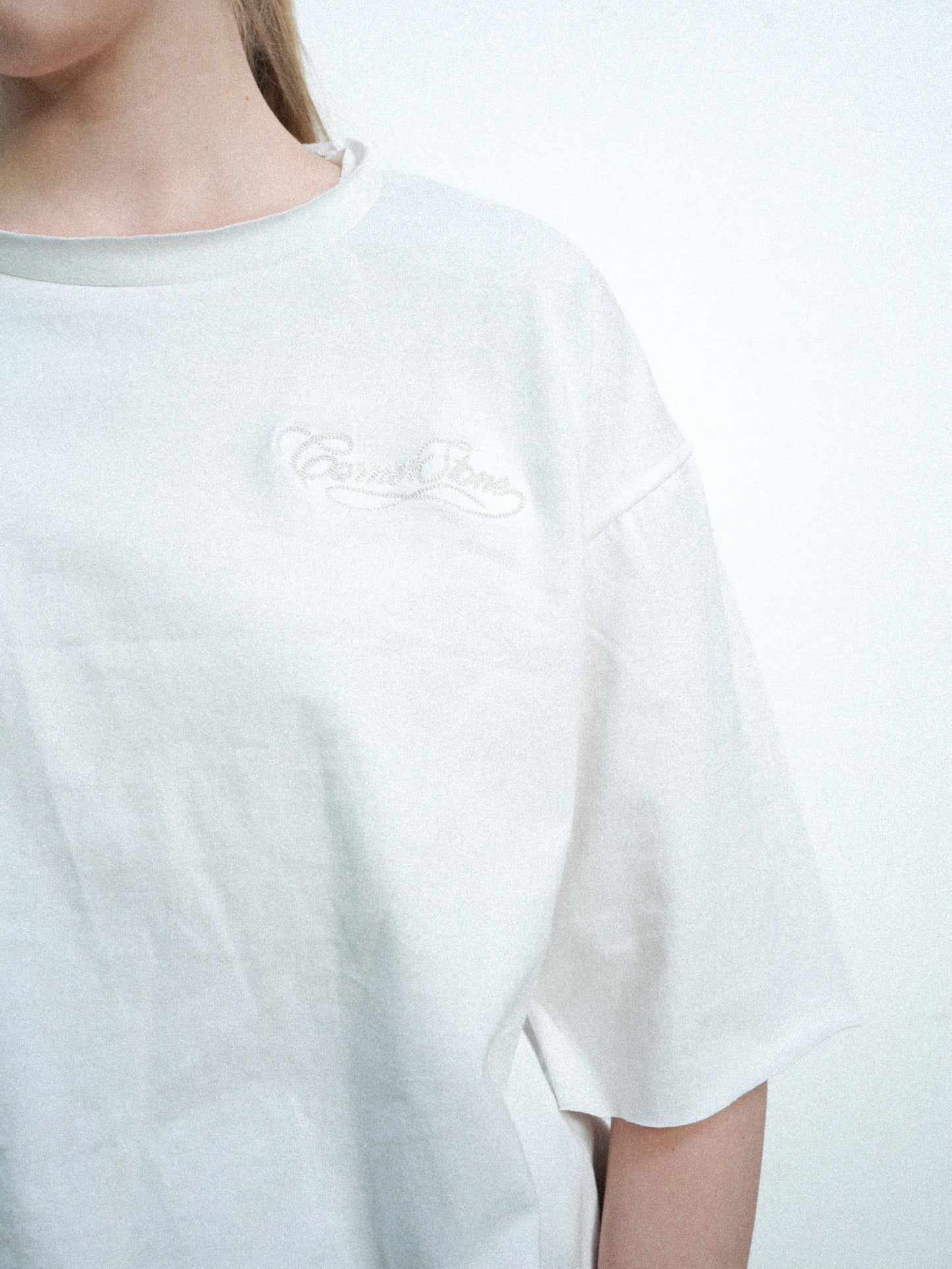 S/S26 DECONSTRUCTED EMBROIDERED RAW HEM TEE IN WHITE