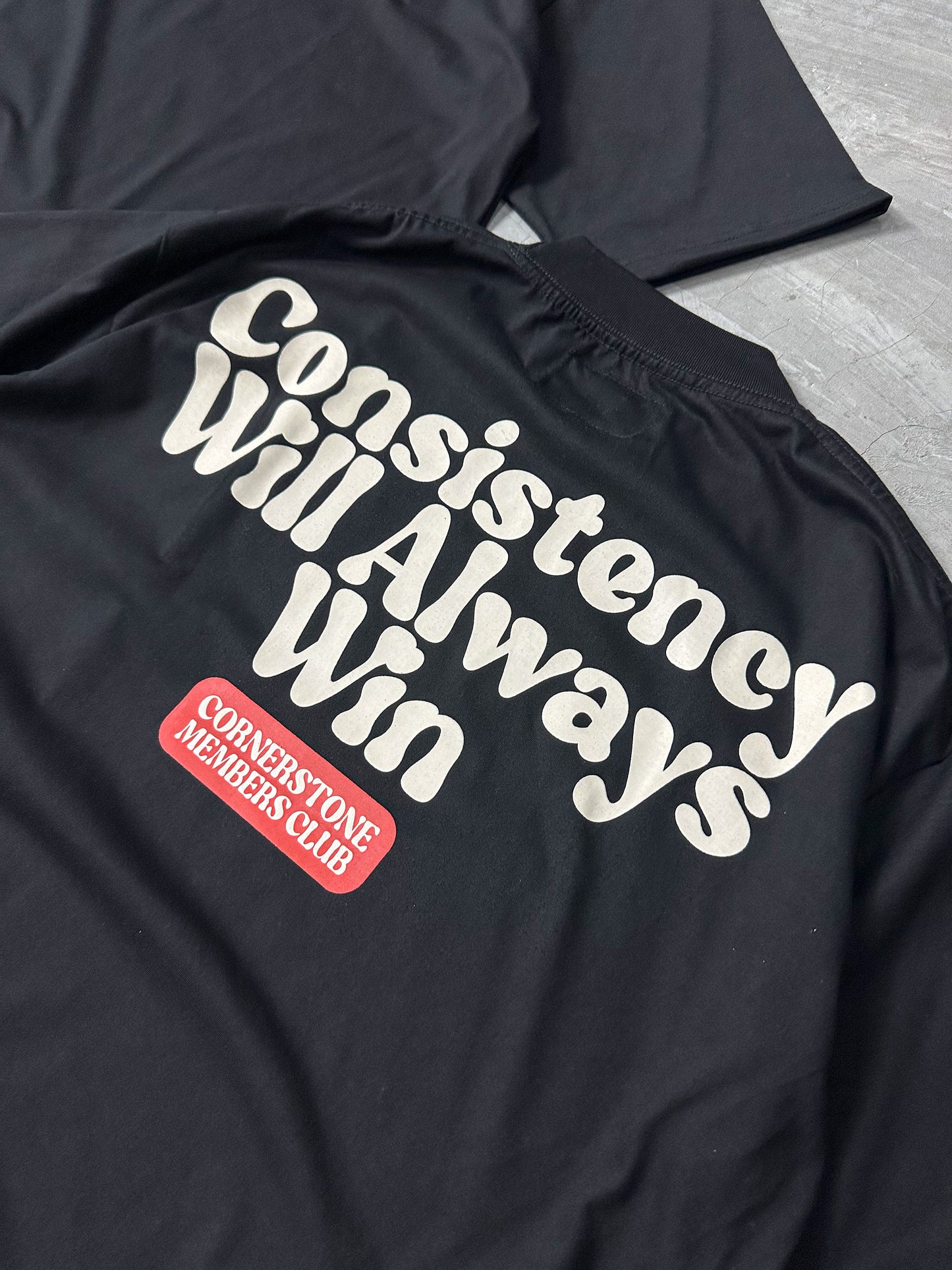 "CONSISTENCY" T-SHIRT IN BLACK